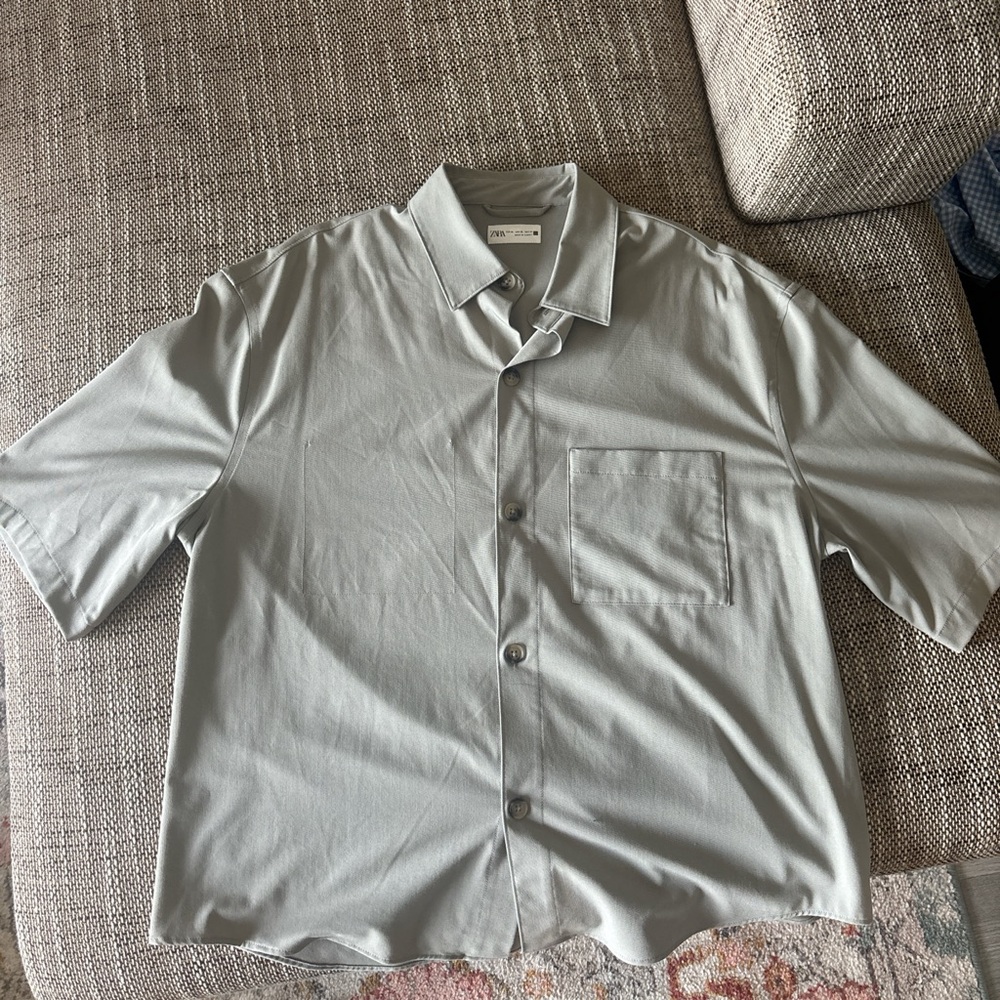 Bundle of men's short sleeve collared shirts.